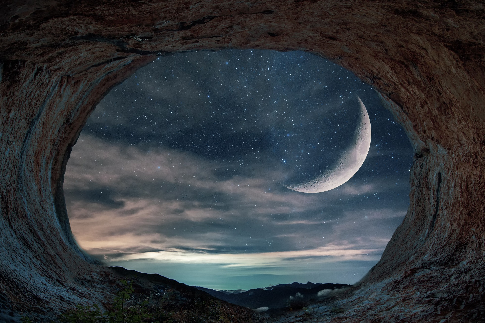 landscape picture of the crescent moon taken within cave